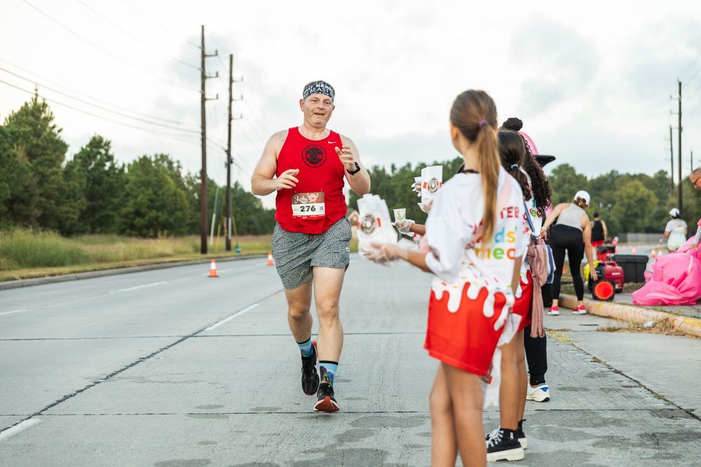 Community 5K run photography in Houston capturing running moments