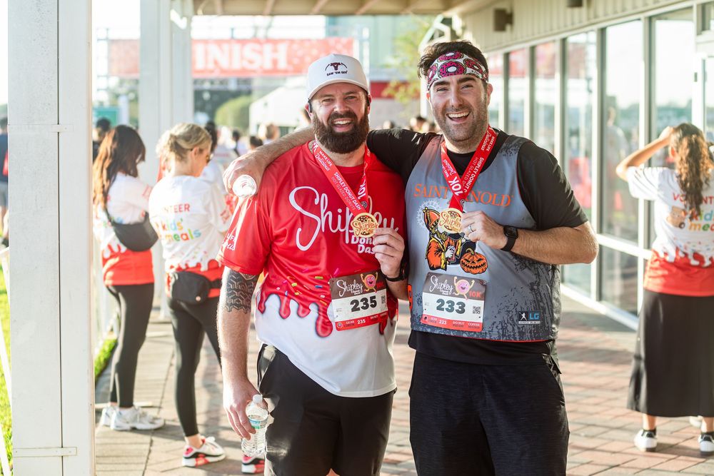 unners wearing medals at the Shipley Donut Dash 5K in Houston TX