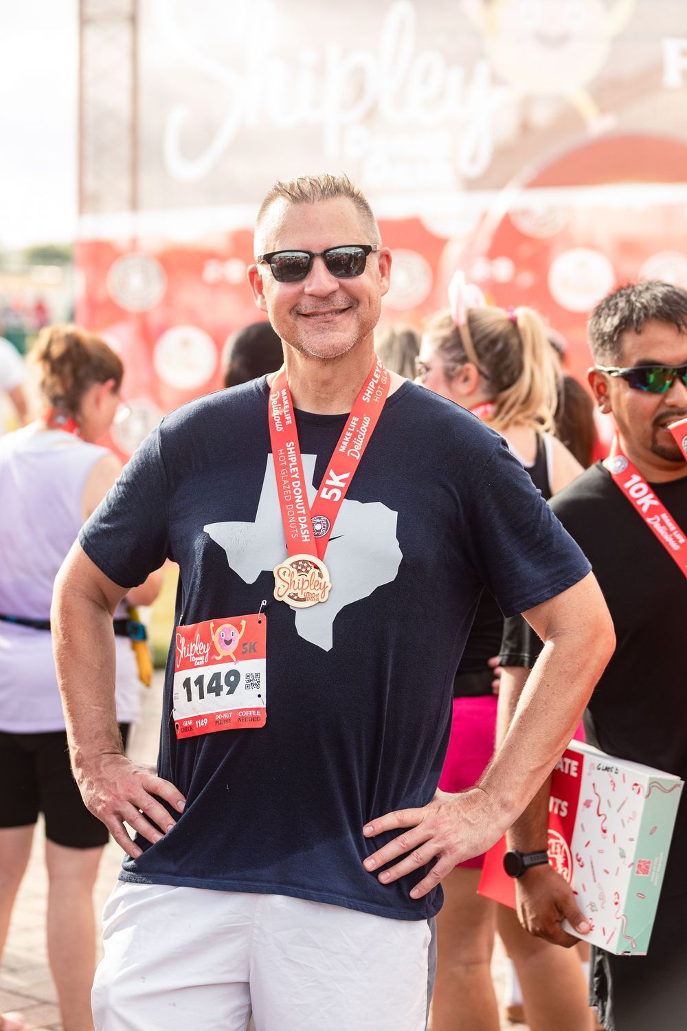 runners wearing medals at the Shipley Donut Dash 5K in Houston TX