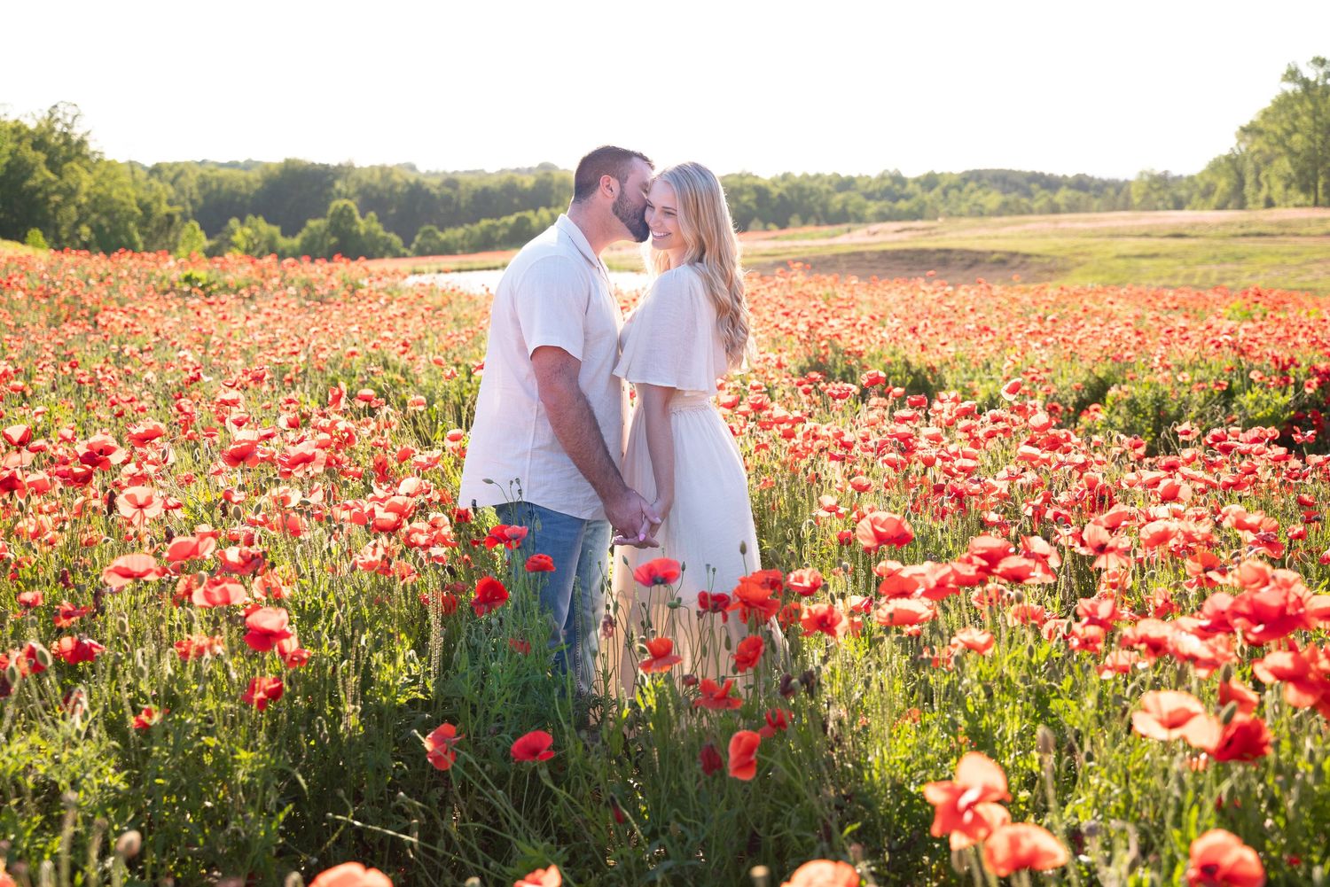 Engagement in poppies photo