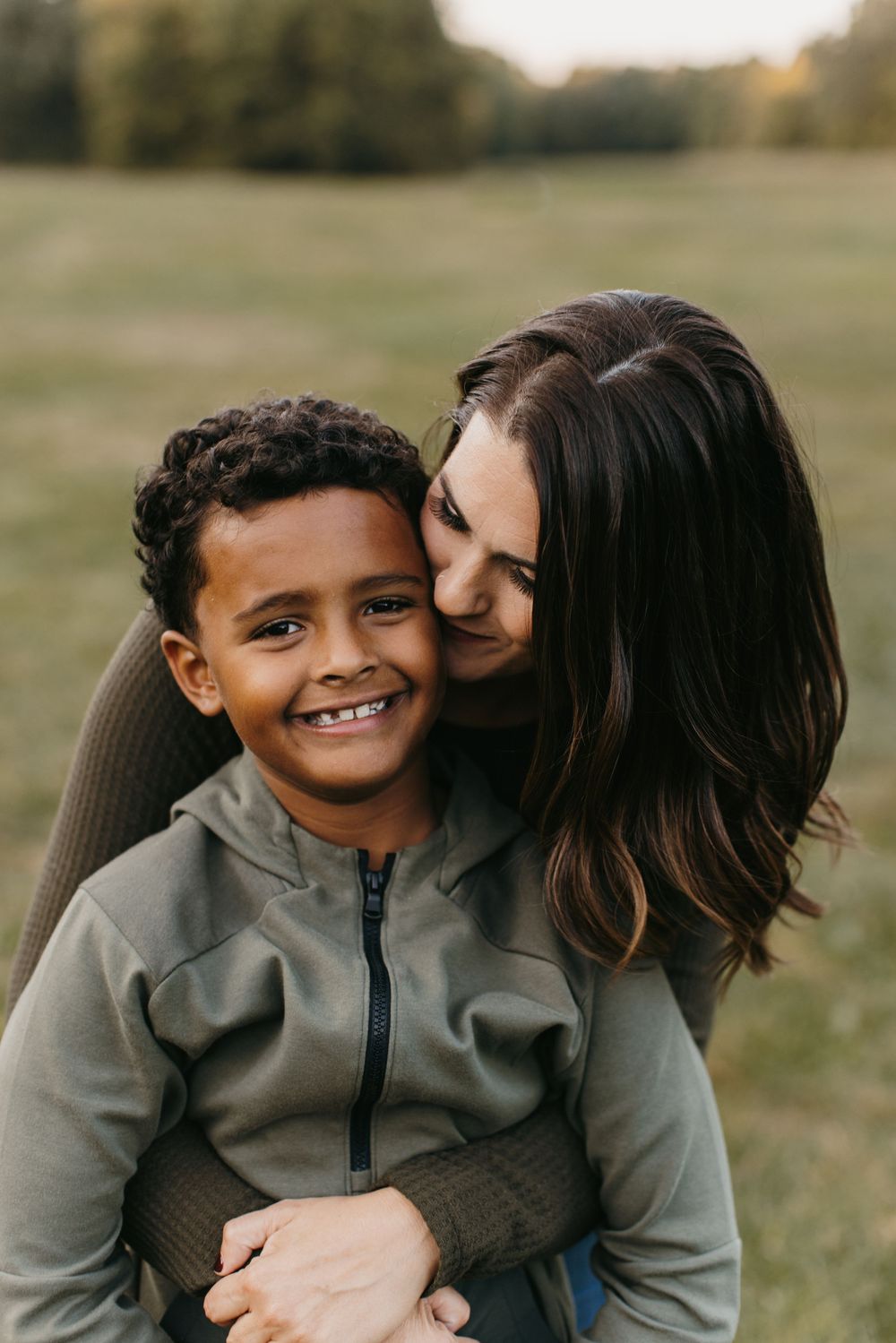A young black son with his single Mom. Mother and Son photo shoot in Cuyahoga Valley National Park.