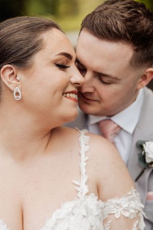 Close-up wedding portrait capturing intimate moment between newlyweds.