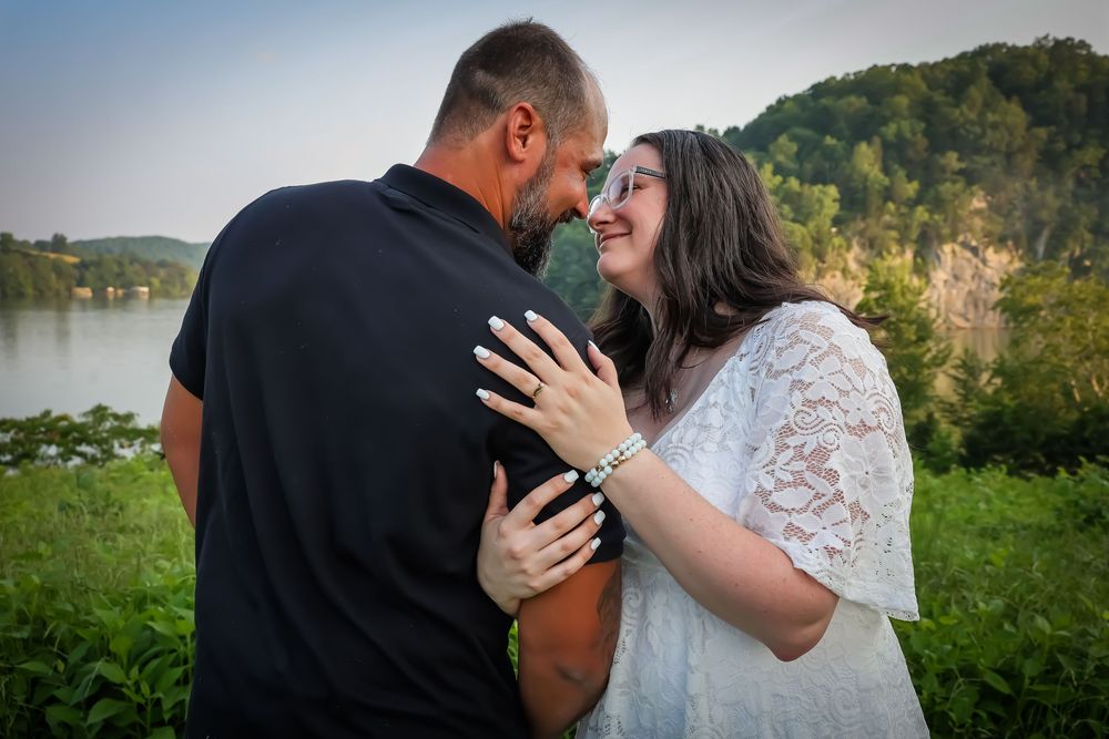 Romantic outdoor wedding photos captured against a scenic natural landscape.