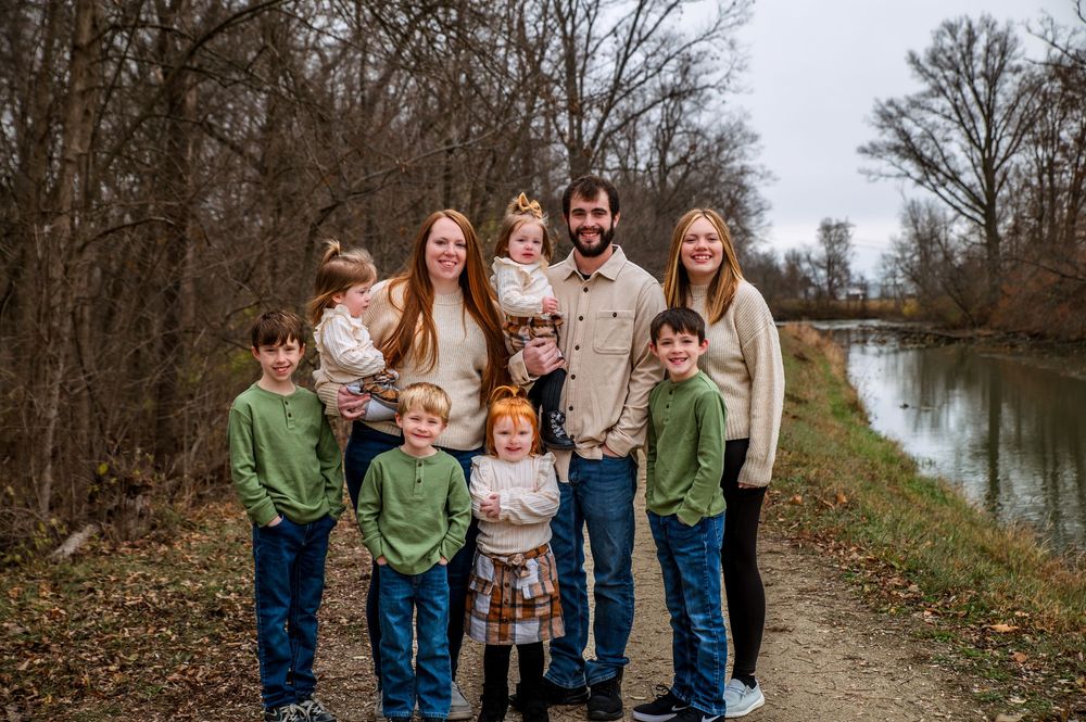 Family enjoying an outdoor photography session in St. Marys, Ohio