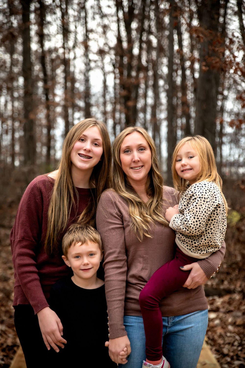 Family of four enjoying an outdoor photography session in St. Marys, Ohio