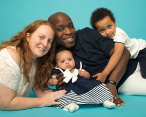 Family pose on aqua blue background. Family photography studio, High Wycombe, Abigail's Studio