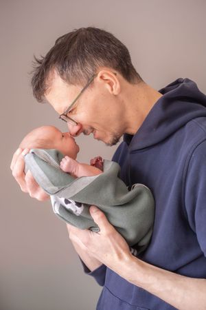 First time dad nose to nose with newborn baby.
