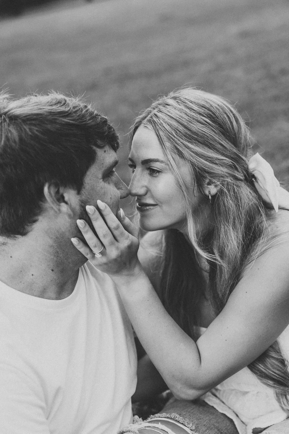 Black and white sequence showing a tender dynamic between two lovers sharing a romantic kiss.