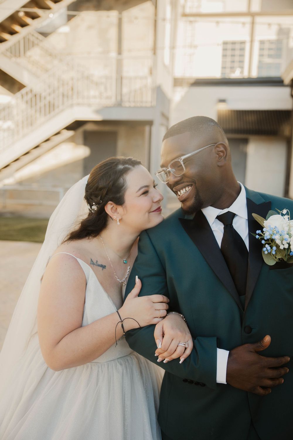 Wedding couple sharing intimate moments in a beautiful outdoor setting with natural lighting.
