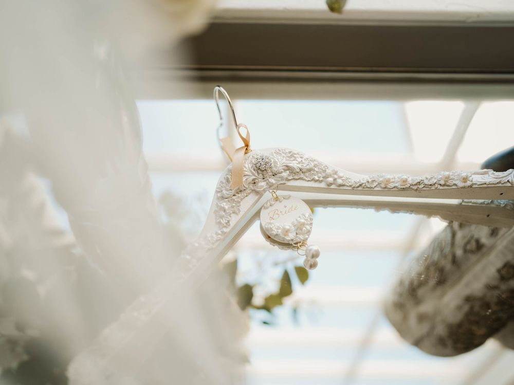 Delicate lace details and wedding accessories captured in soft, natural light.