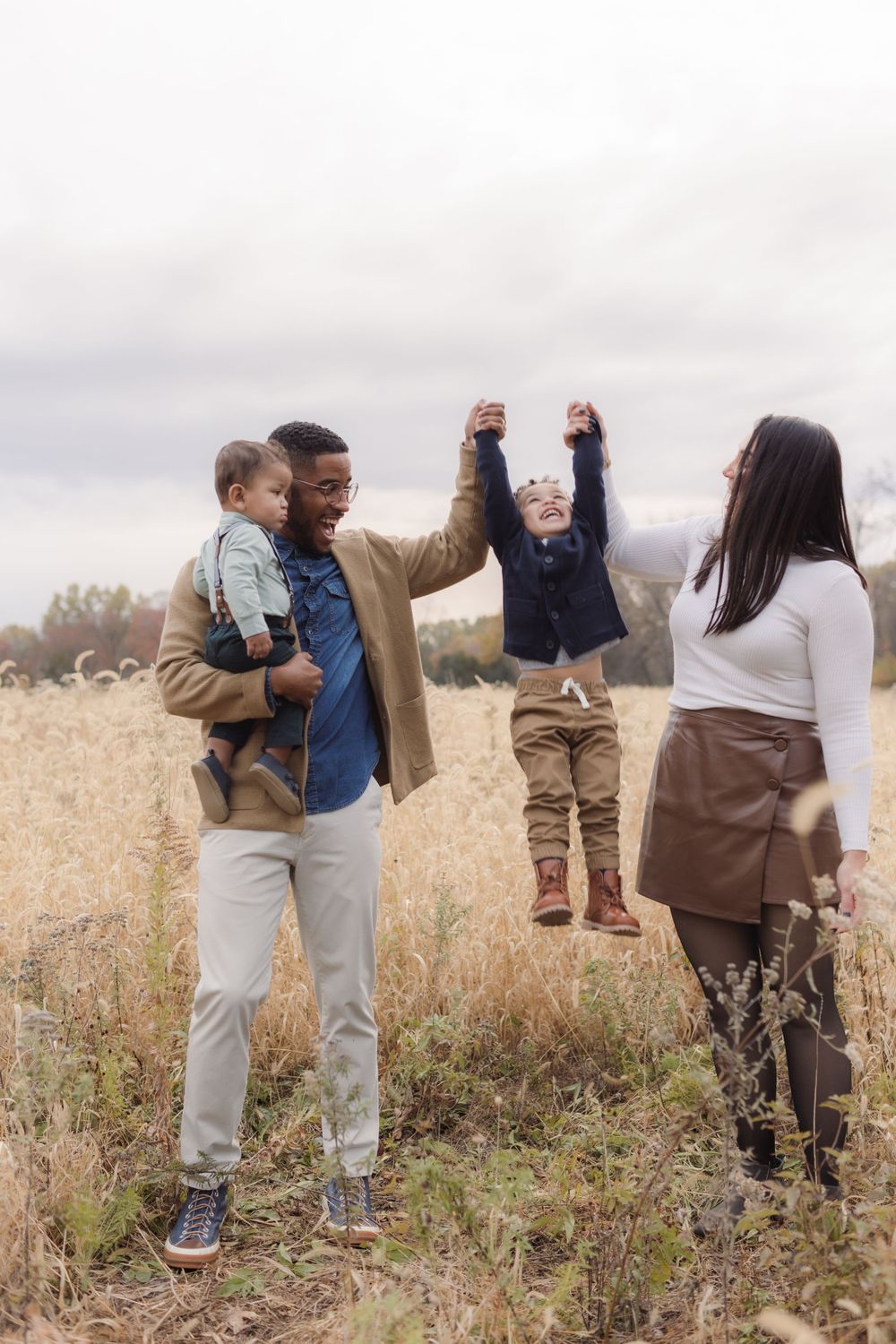 Family photos in a field of in Columbia Missouri photographer