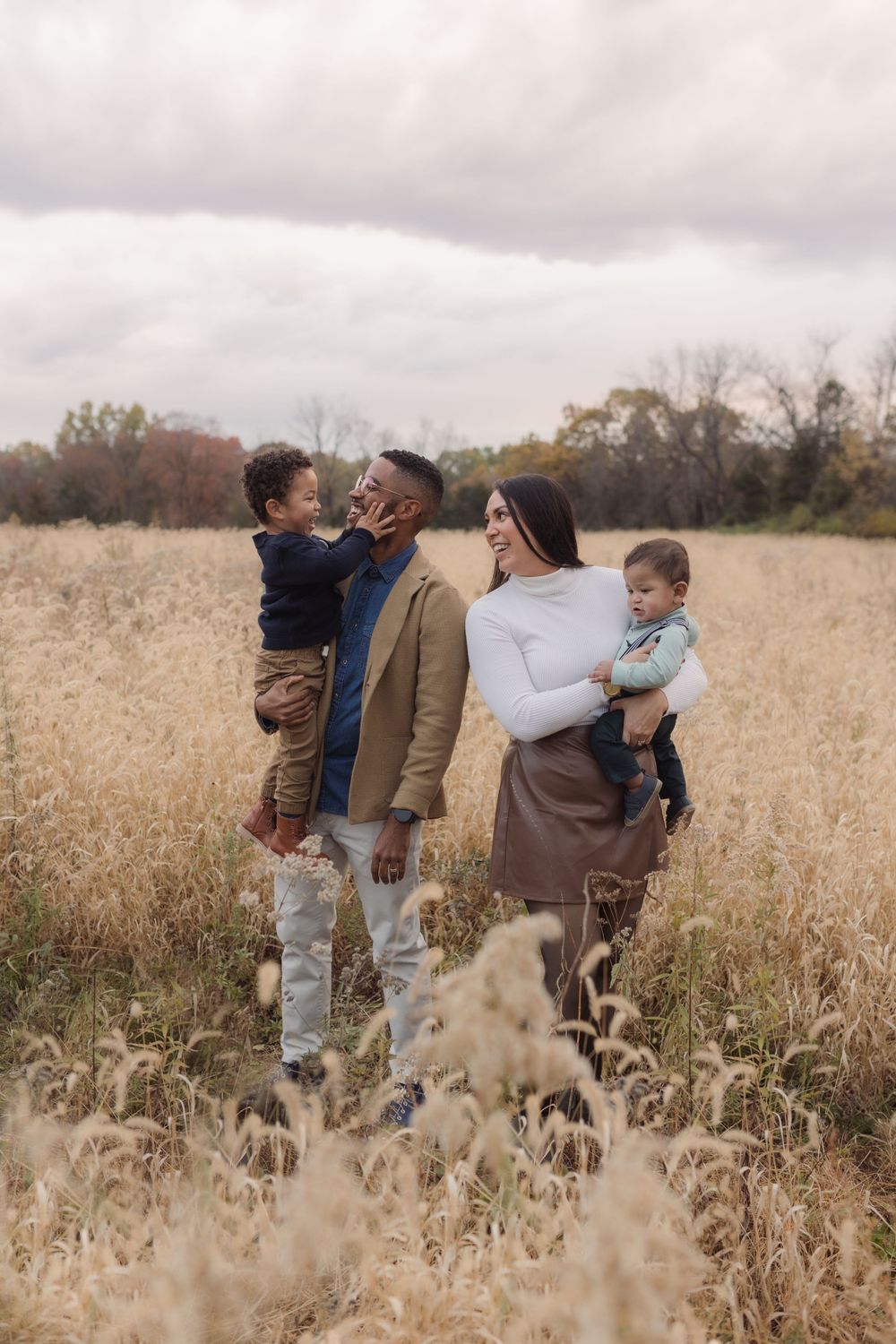 Family photos in a field of in Columbia Missouri photographer