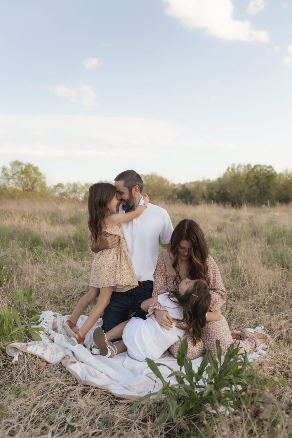 Family photos in a field of in Columbia Missouri photographer