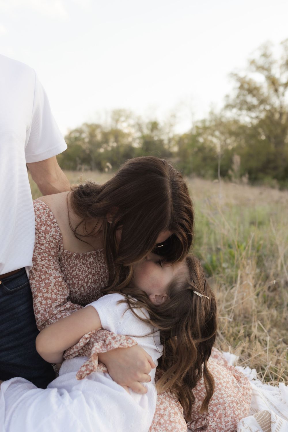 Family photos in a field of in Columbia Missouri photographer