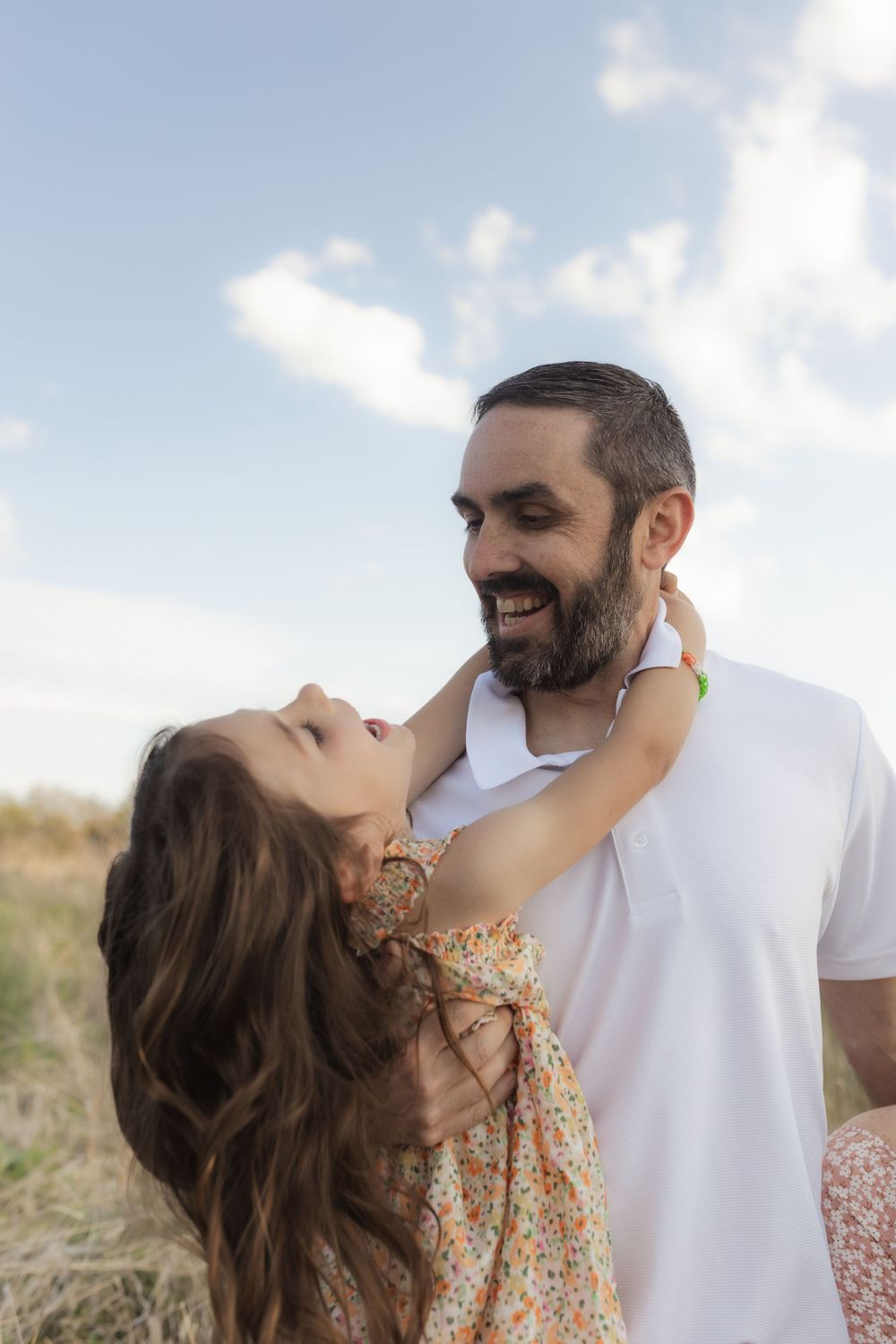 Family photos in a field of in Columbia Missouri photographer