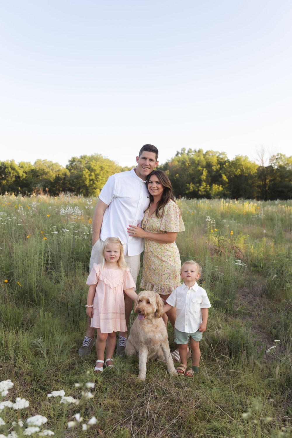 Family photos in a field of wildflowers in Columbia Missouri photographer