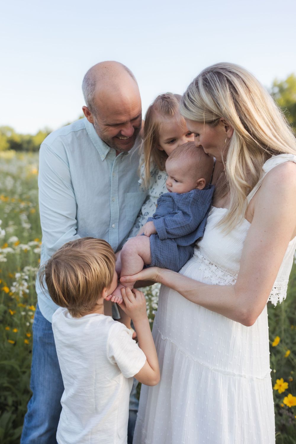 Family photos in a field of wildflowers in Columbia Missouri photographer