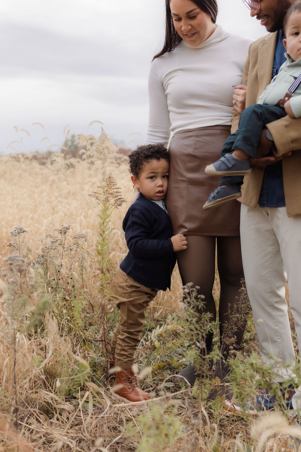 Family photos in a field of  in Columbia Missouri photographer