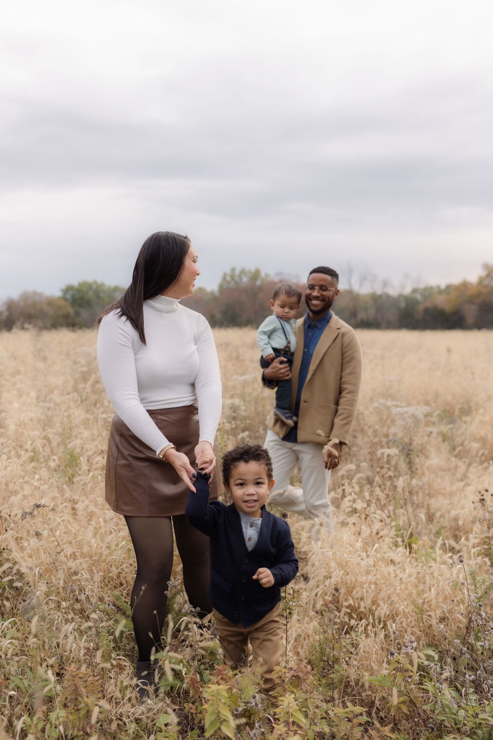 Family photos in a field of in Columbia Missouri photographer
