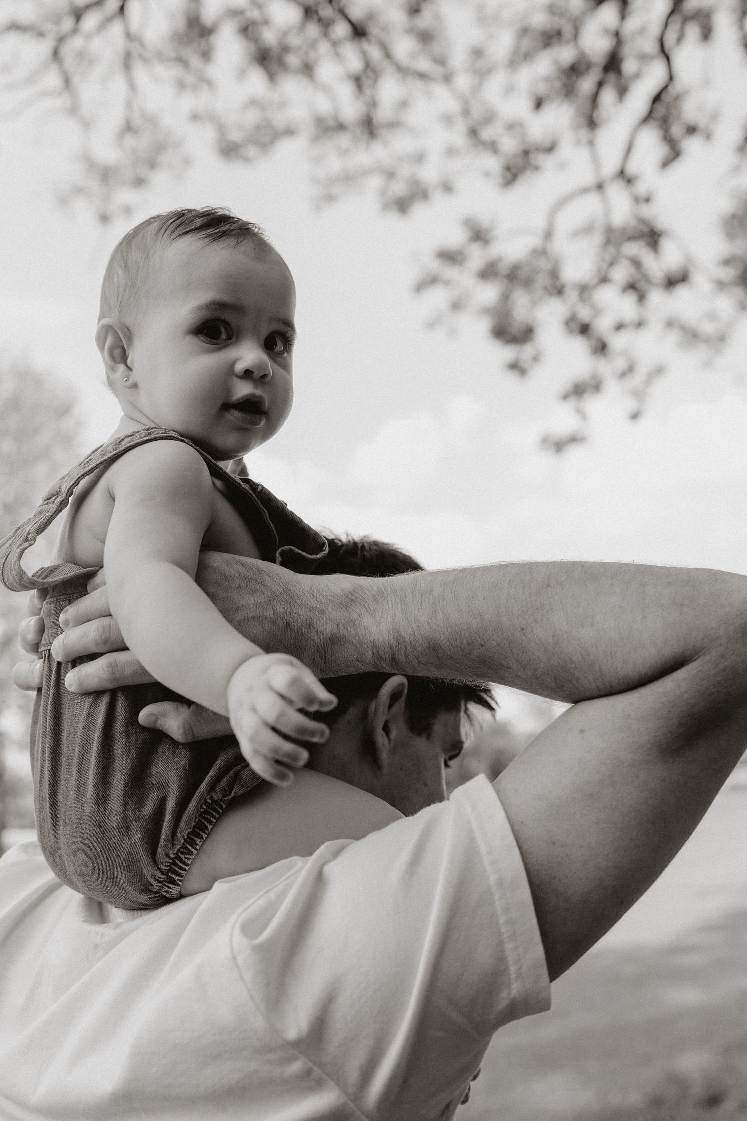 Black and white series of tender moments between parent and child.