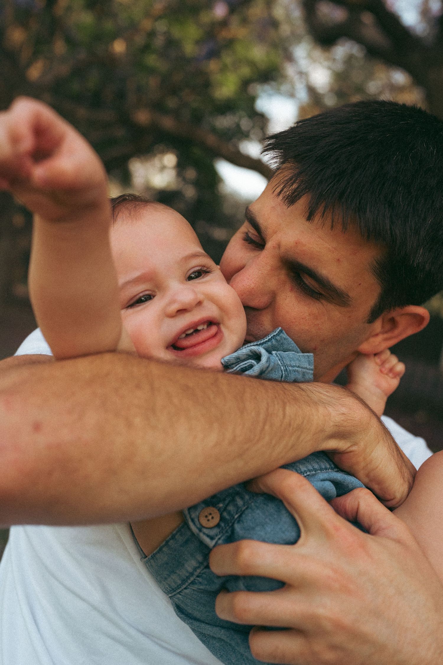 Candid close-up photo series showing playful affectionate moments between parent and child in natural light.