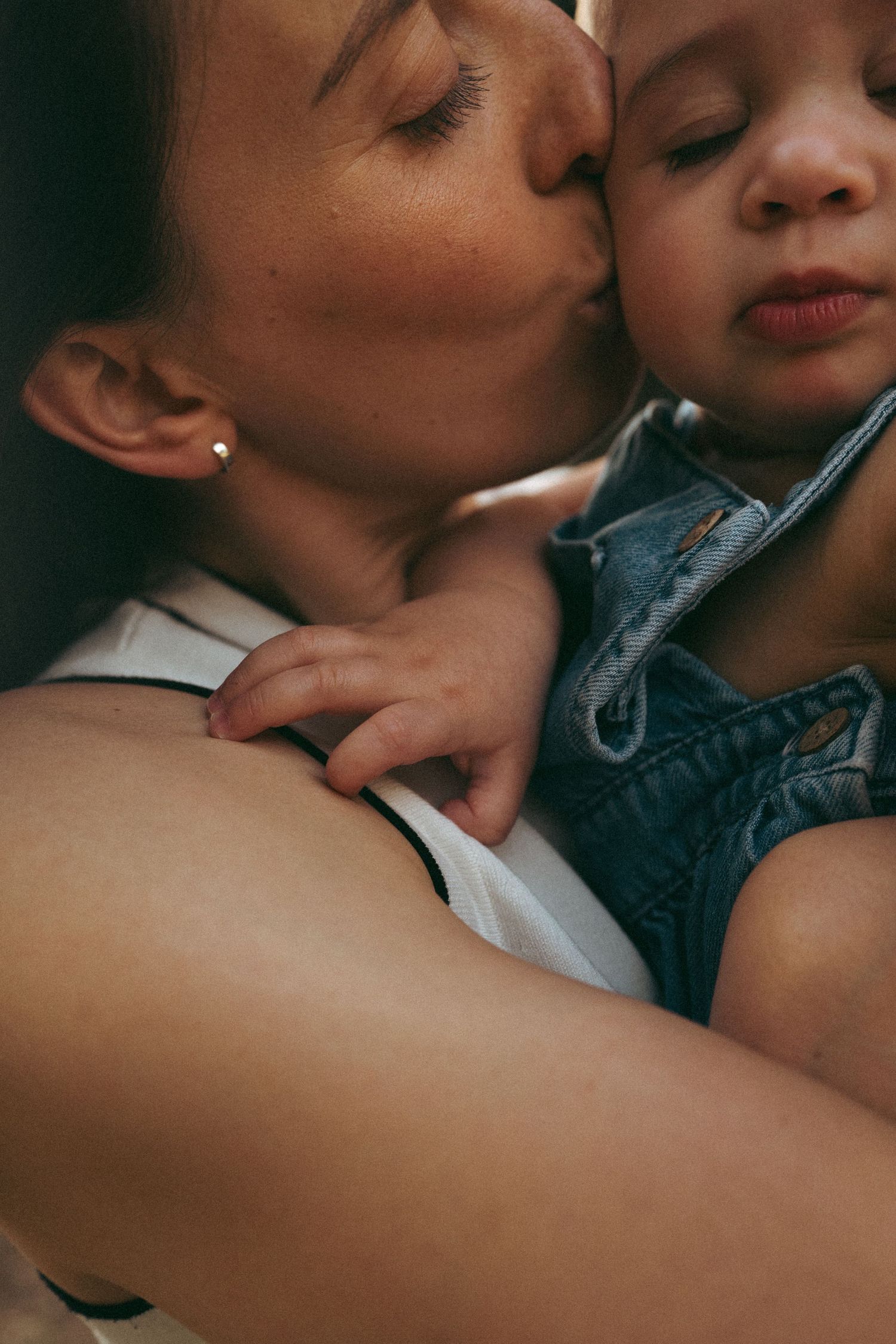 An intimate close-up of a tender moment between parent and child.