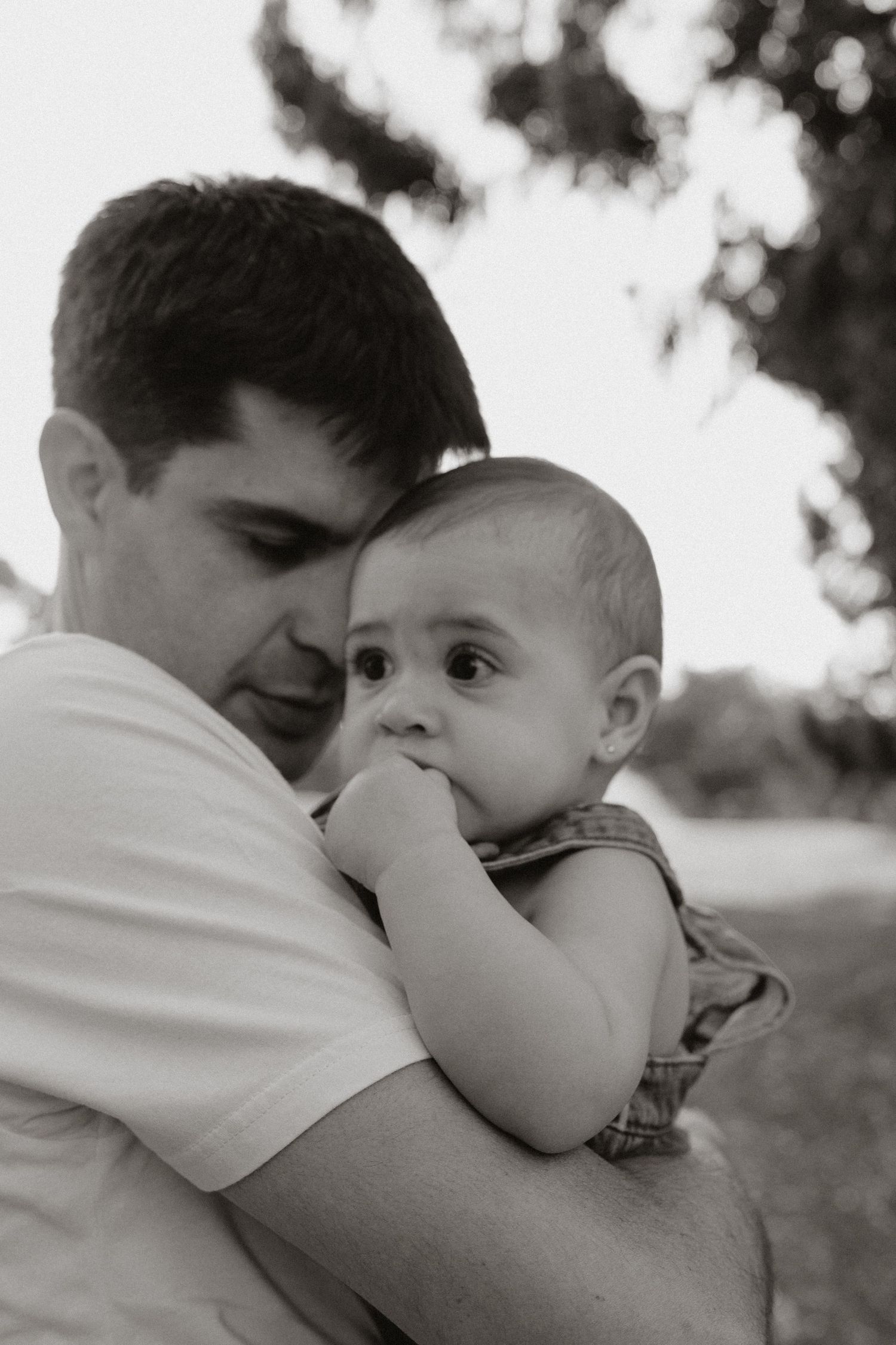 Intimate black and white portraits showing loving parent-child connection.
