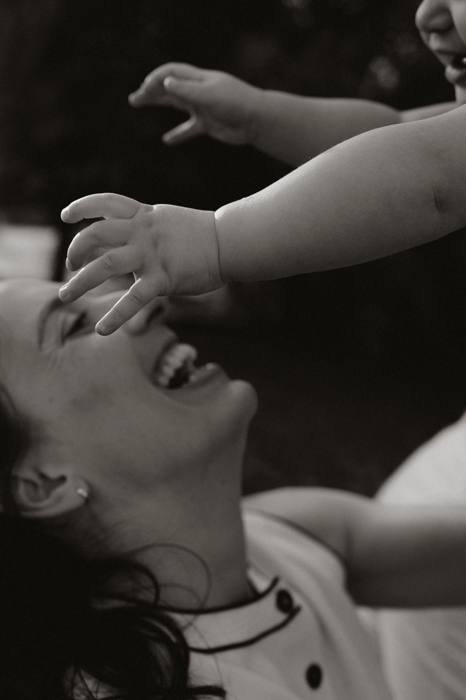 Black and white artistic portrait series showing joyful expressions and gestures.