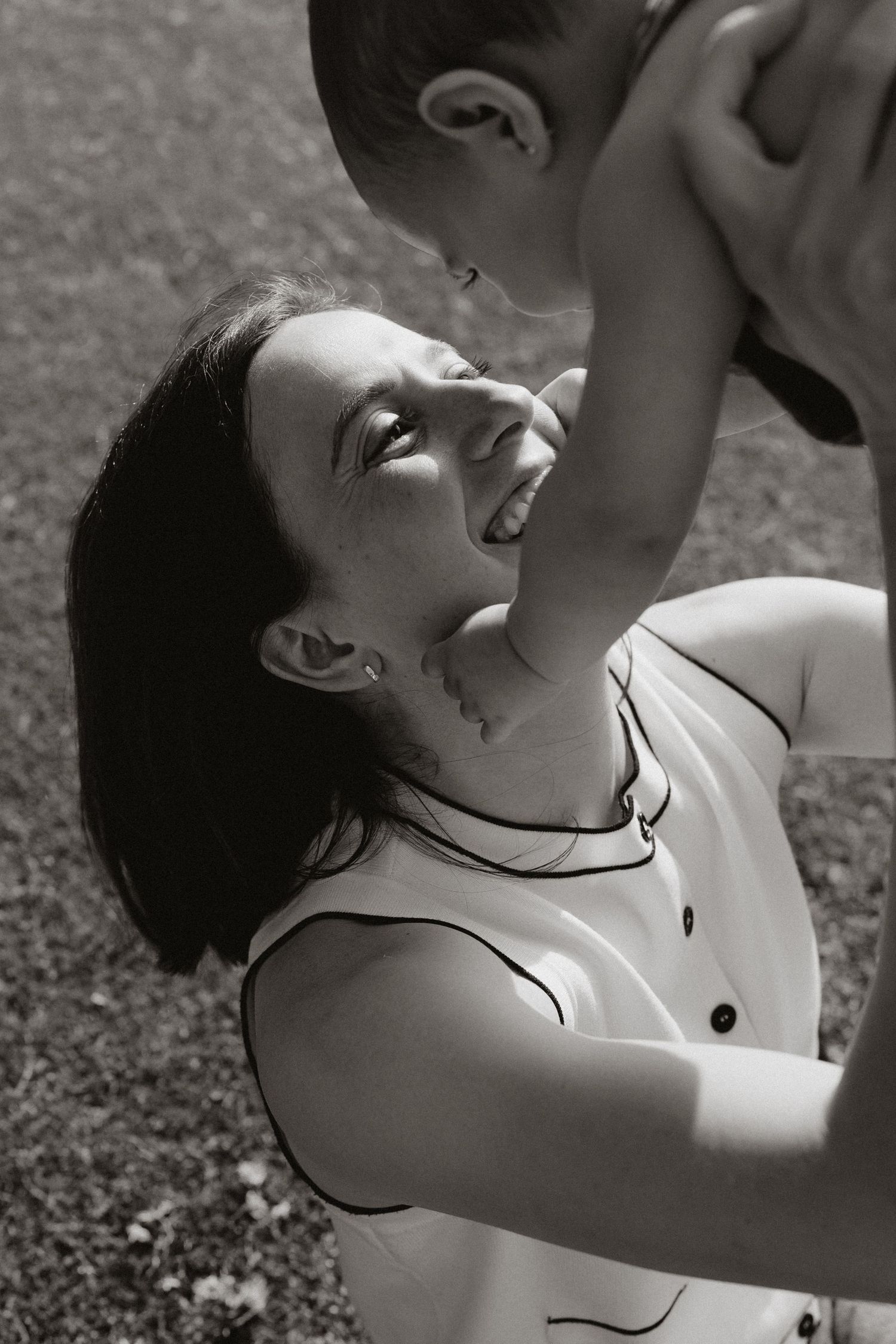 Black and white artistic portrait sequence showing joyful expressions.