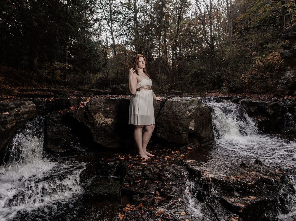 A series of nature photos showing a waterfall and stream in a forest setting during autumn of a senior.