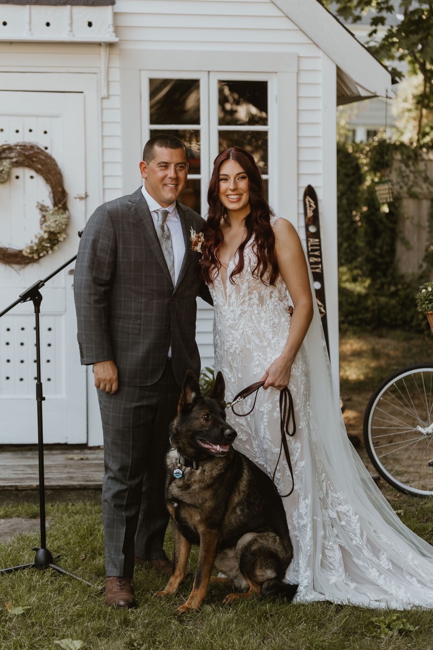 Outdoor Summer wedding portraits in Long Island with bride, groom and dog