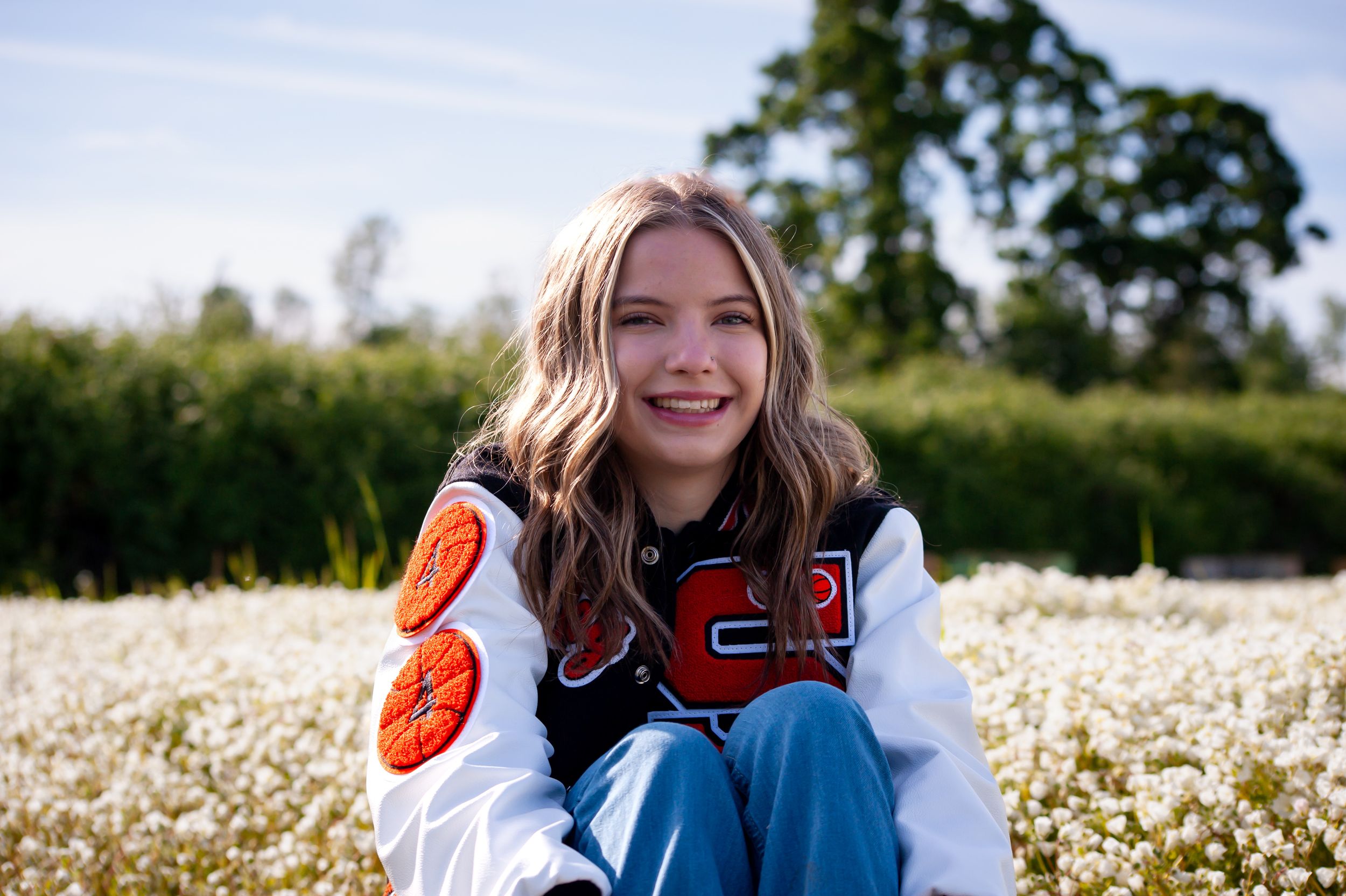 Senior Smiles in a meadowfoam field