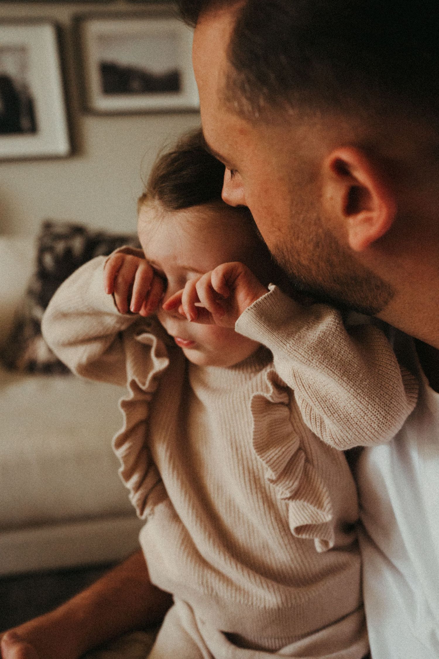 Warm toned series of close-up shots showing gentle family interaction.