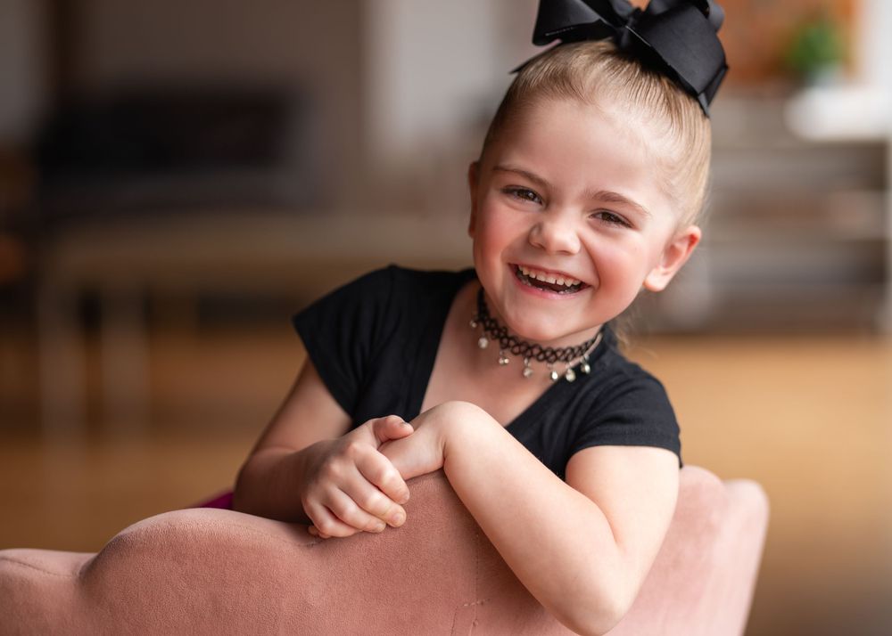 A series of candid portrait shots showing joyful expressions and genuine smiles in warm indoor soft lighting.