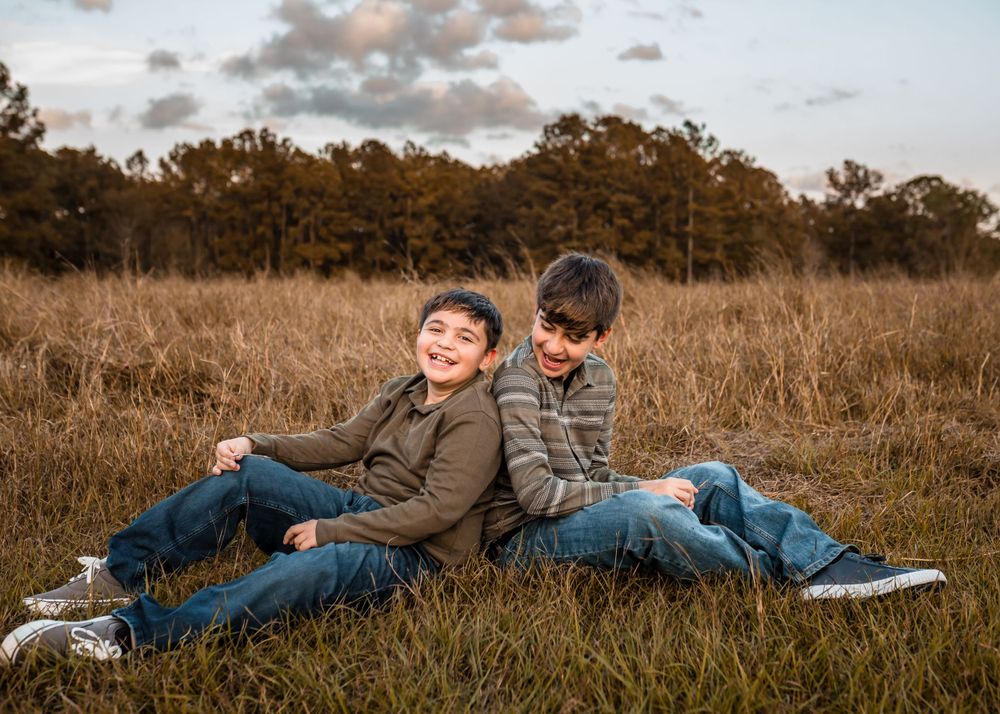 Brothers pose together in a family session during the Fall season.