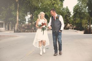 Casual walking shots of a couple on a tree-lined street path.