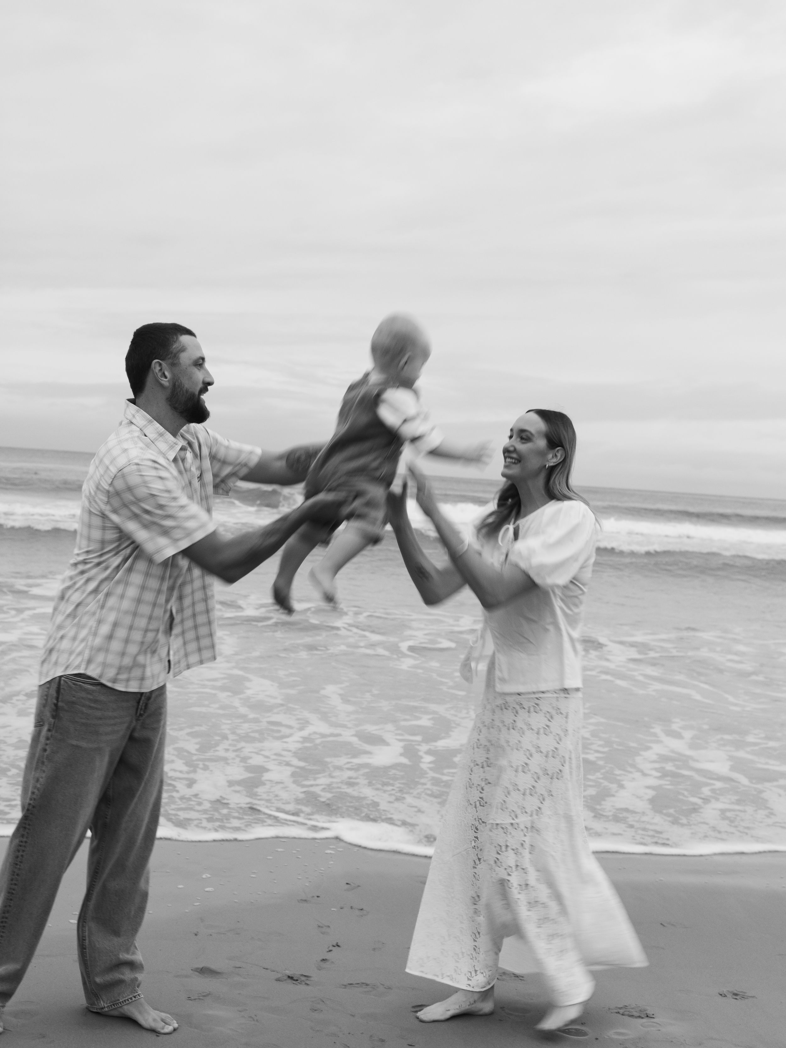 Candid family photoshoot capturing natural connection and movement