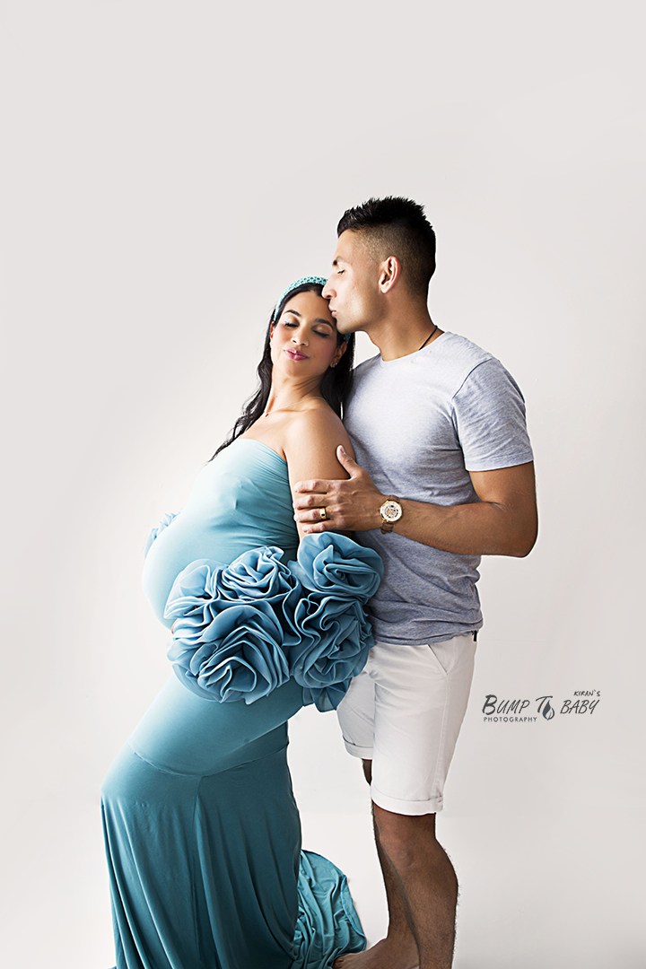 Couple maternity photoshoot in Melbourne with partner holding pregnant belly