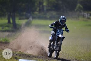 Motorbike flicking up dust