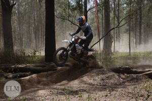 Motorbike jumping a log