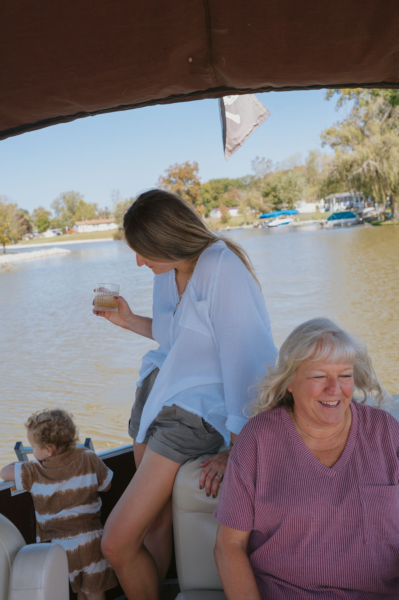 People enjoying a relaxing boat ride on a sunny afternoon in Muskegon MI