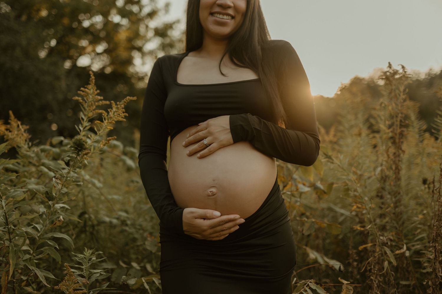 A series of maternity photos captured during golden hour in a field of wildflowers at sunset