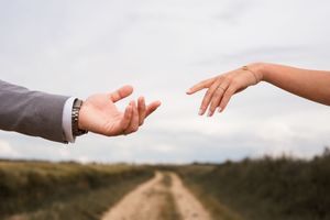 A series of hands reaching out and touching in various positions against white backgrounds.