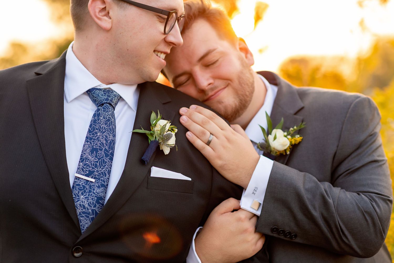 Romantic sunset wedding photos showing tender moments between newlyweds against a golden sky in Waterloo behind Canadian Clay & Glass Galler