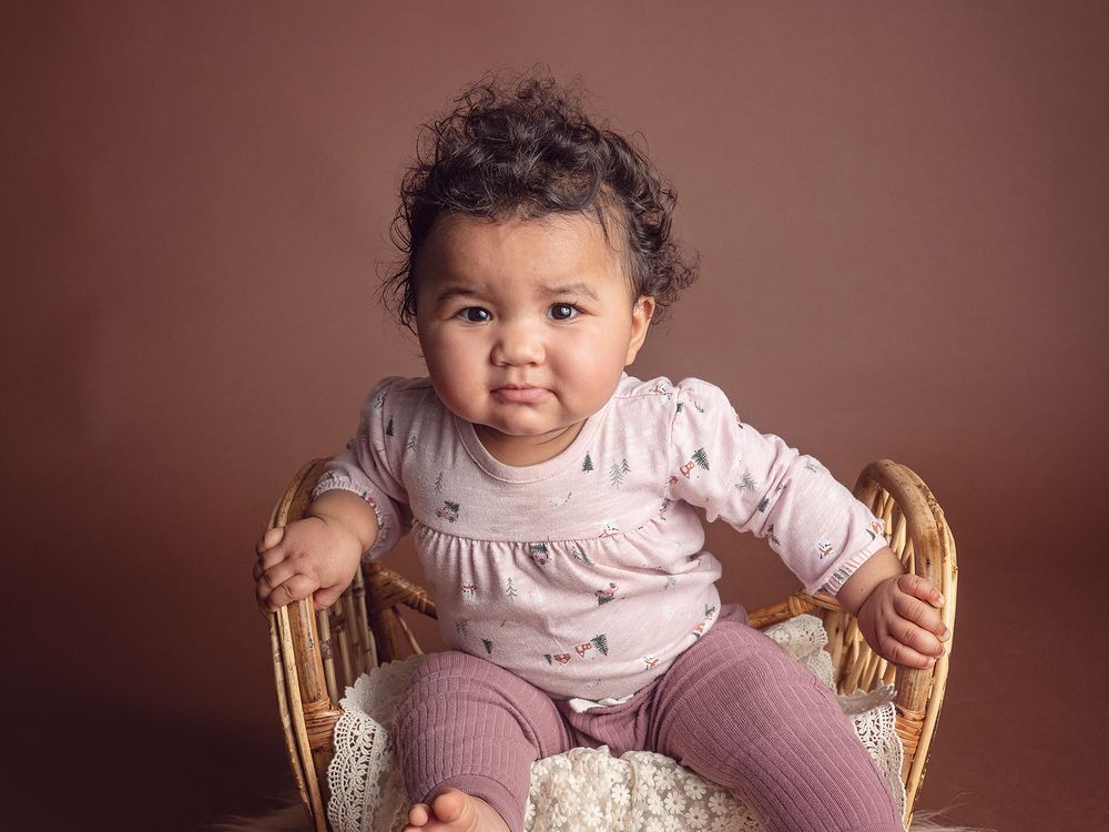 baby on a wicker bed