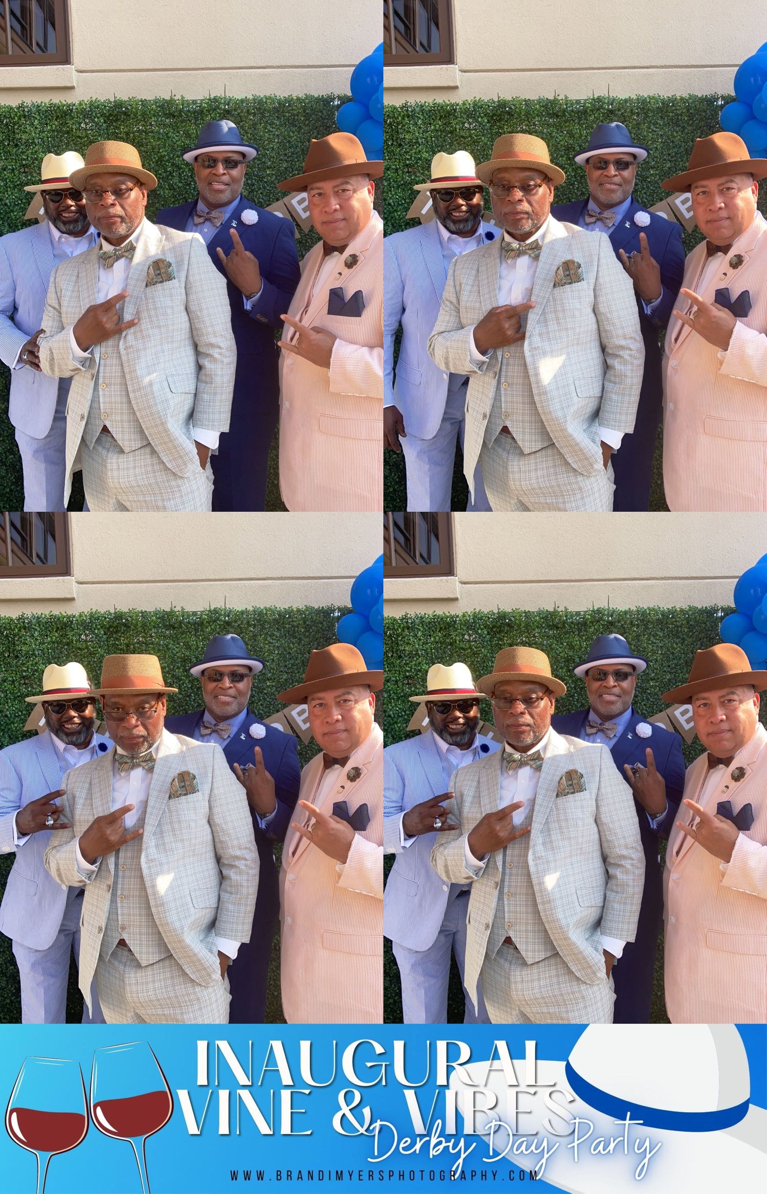 A group in coordinated formal attire including white suits, peach outfits and panama hats pose at an inaugural wine event.