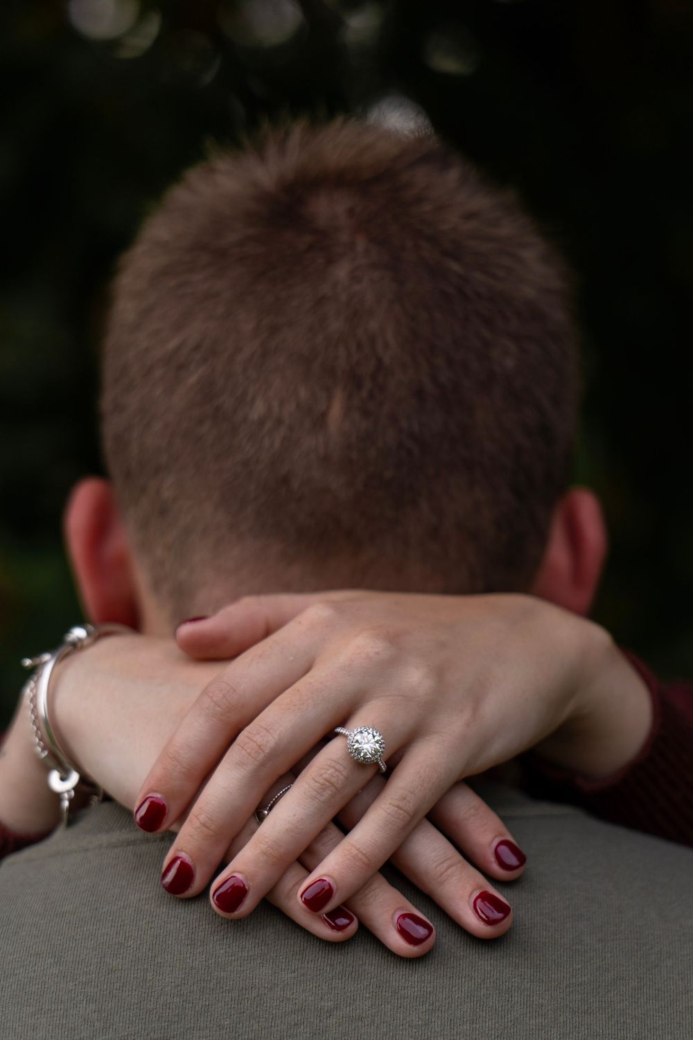 Engaged couple hugging during an outdoor photo session