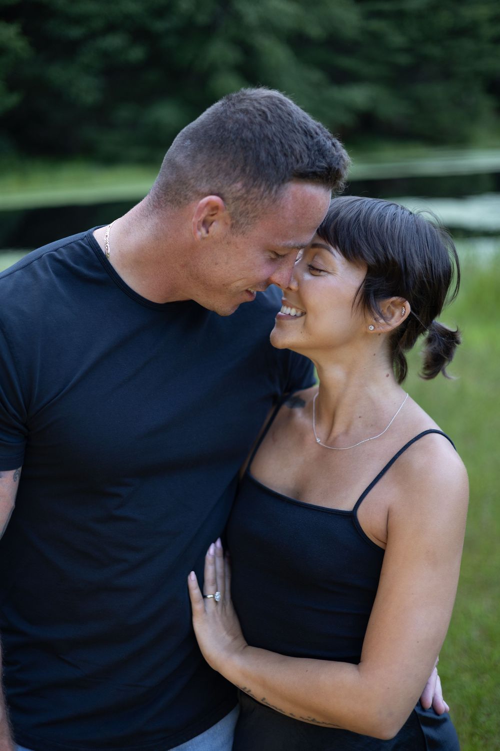 Engaged embracing dancing during a golden hour session