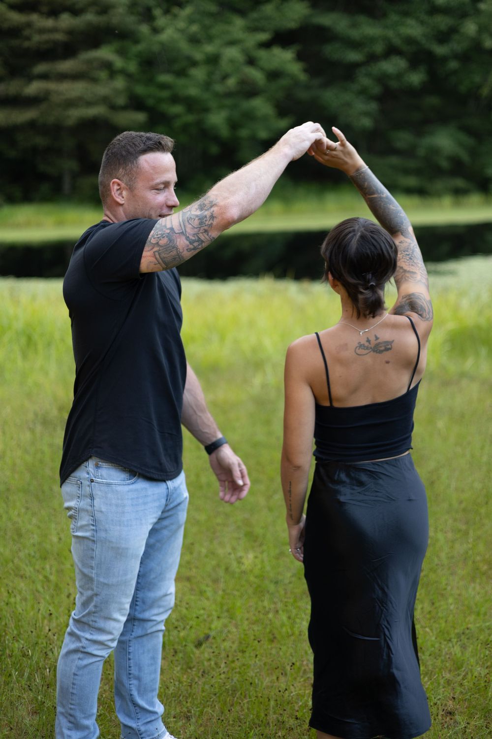 Engaged couple dancing during a golden hour session