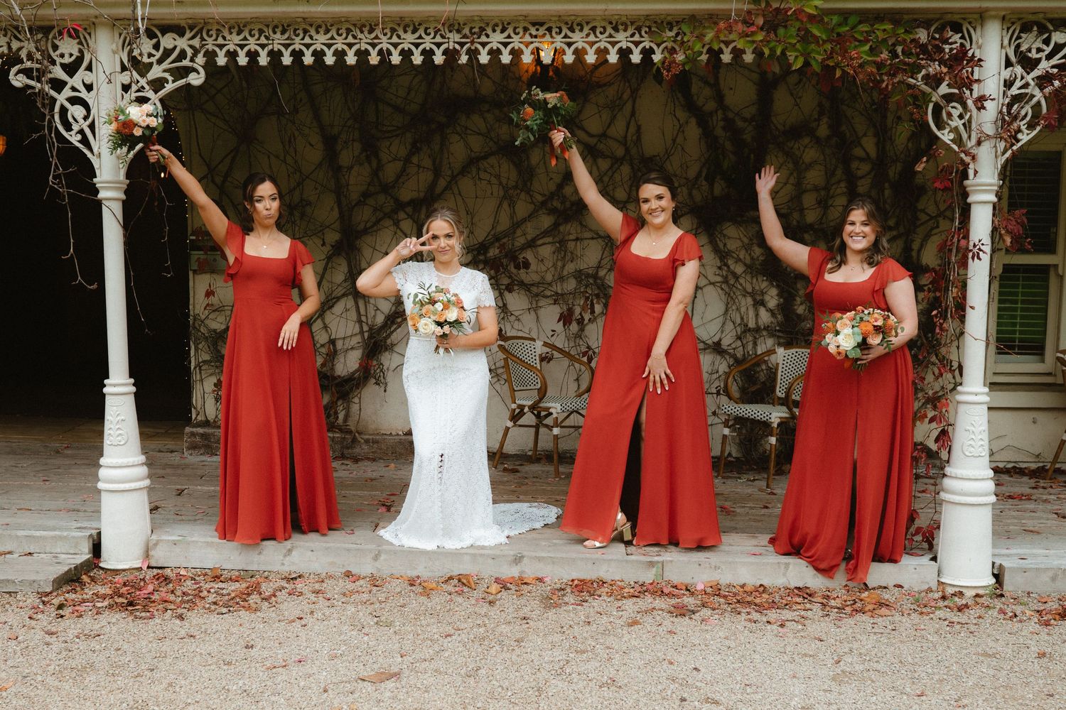Bride and bridesmaids celebrating beneath the garden gazebo at BrookLodge.